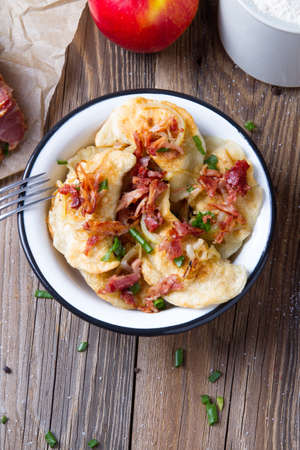 Polish fried dumplings with meat, onion and bacon.の写真素材