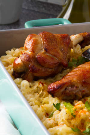 Baked spicy wings of turkey with cheese noodles.の写真素材