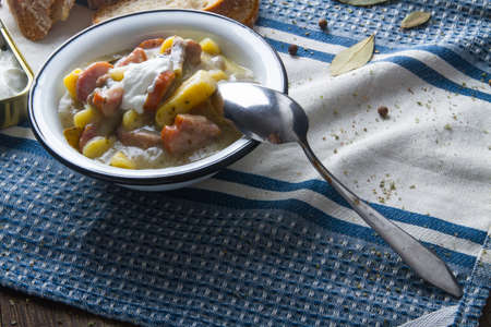 Polish sour soup with sausage and bread.の写真素材