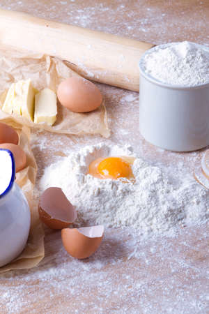 Dough recipe ingredients on wood kitchen table.の写真素材