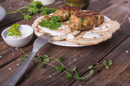 Turkish kofta with flatbread on a plate. Salad and ayran in the backgroundの写真素材