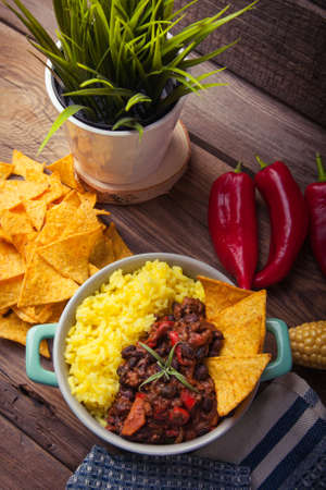 Homemade chilli con carne with beans, pepper and rice in bowlの写真素材