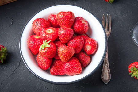 Bowl of fresh harvested strawberries. Perfect breakfastの写真素材