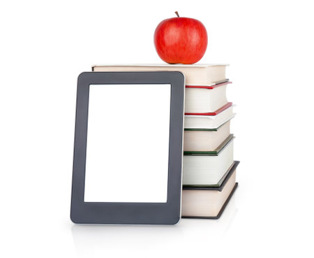 E-book near the stack of hardcover books with apple on the top isoalted on white. Education conceptの写真素材
