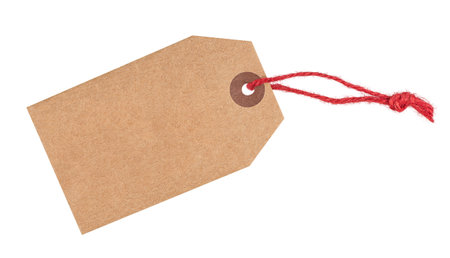 Recycled paper tag with red twine isolated on white background, copy spaceの写真素材