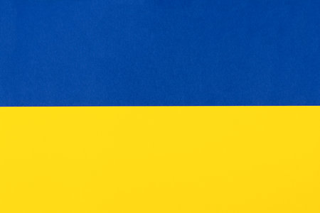 Blue and yellow paper background in the colors of the national flag of Ukraineの写真素材
