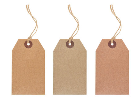 Set of three hanging blank craft paper tags isolated on white backgroundの写真素材