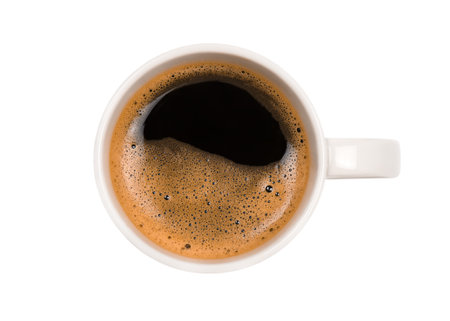 White mug with coffee isolated on white background, top viewの写真素材