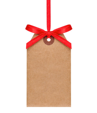 Hanging craft paper tag with red ribbon isolated on white backgroundの写真素材