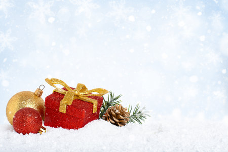 Christmas decorations on snow, Christmas festive backgroundの写真素材