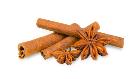 Spices cinnamon sticks and anise isolated on white backgroundの写真素材