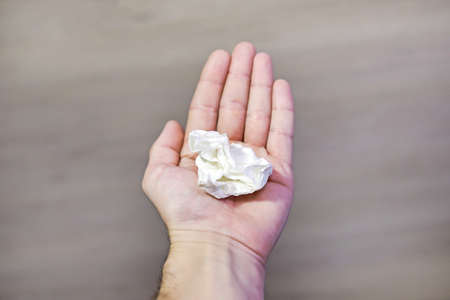 A helping hand always holds out a napkin to patientの写真素材