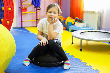 a boy and a girl play and are treated by a psychologist in the center, autism is not a sentence, unique equipmentの写真素材