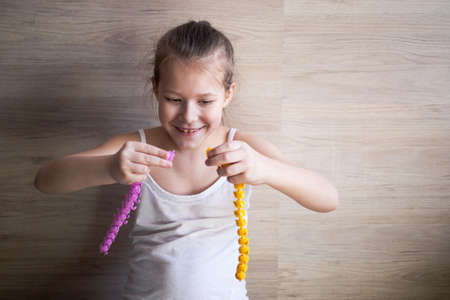 a girl plays with rubber tracks and they fight among themselves.の写真素材