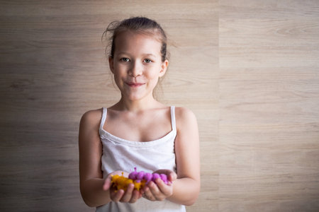 a girl plays with rubber tracks at home and shows them to everyone.の写真素材