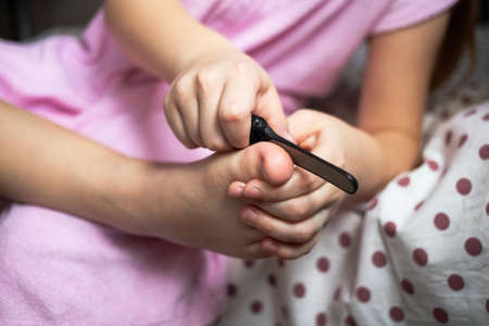 foot cleaning with small toe stone brush, after bath health concept.の写真素材