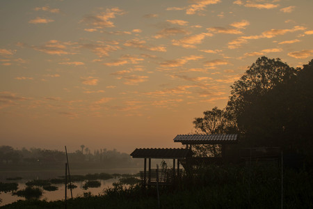 Sunrise by the river with pavilionの写真素材