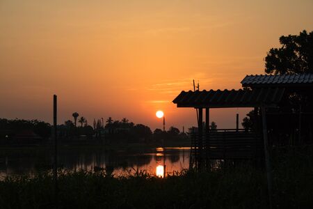 Sunset over a riverの写真素材