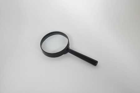 A magnifying glass with white backgroundの写真素材
