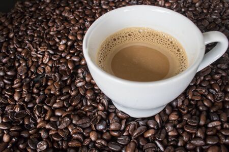 coffee cup on coffee beansの写真素材