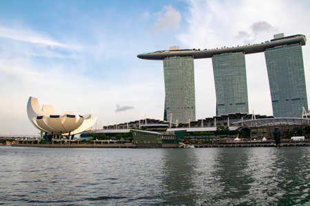 Iconic Singapore landmark featuring a luxury hotel, rooftop infinity pool, casino, shopping mall, and stunning views of the city.の写真素材