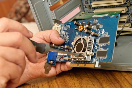 View of a circuit board being repaired  in computer equipmentの写真素材