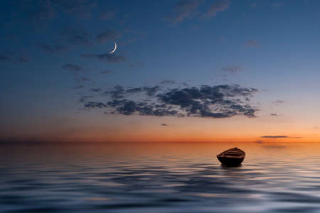 The lonely old boat at the ocean, evenig sky with moon and clouds on backgroundの写真素材