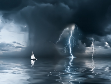Yacht at the ocean, comes nearer a thunderstorm with rain and lightning on backgroundの写真素材