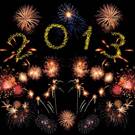 Beautiful colorful 2013 new year fireworks on the black sky backgroundの写真素材