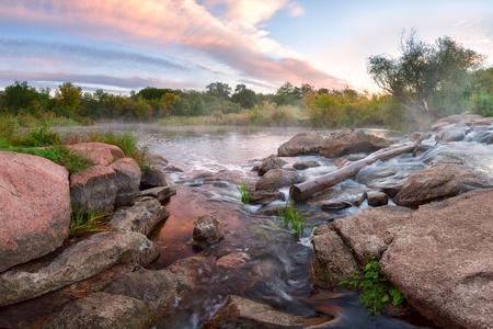 Landscape with mountains river and majestic clouds in the skyの写真素材