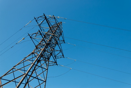 Electricity high-voltage tower on blue sky background