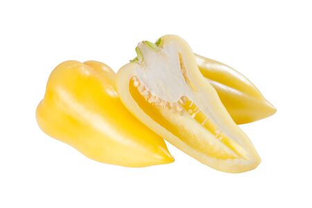 Ripe yellow half and whole sweet pepper isolated on white backgroundの写真素材