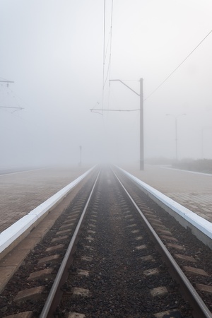 Railway in fog on station, outdoor landscapeの写真素材