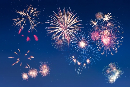 Beautiful colorful holiday fireworks in the night sky with star, long exposureの写真素材