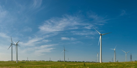 Landscape with windmills on field, alternative energy, panorama