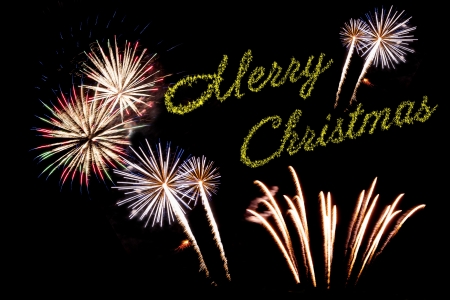 Beautiful Christmas fireworks on the black sky background