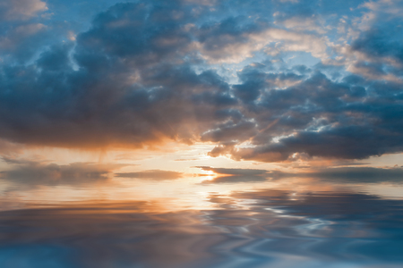 Majestic sunset reflection in waterの写真素材