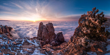 Majestic sunrise over clouds in mountainの写真素材