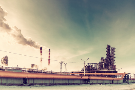 Vintage industrial landscape with chemical factory, pipes and smokeのeditorial素材