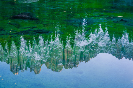 Autumn landscape with lake, forest and mountainsの写真素材