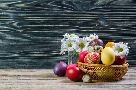 Easter painted eggs on wooden rustic table