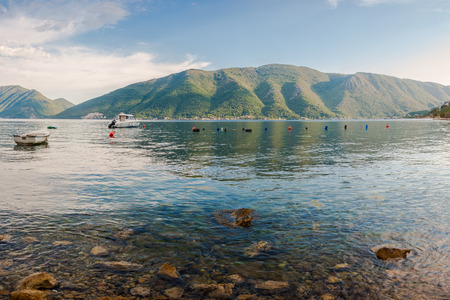 Adriatic seascape with boat and mountains, Boka Kotorska, Montenegro