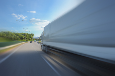 Track in motion blur on highway, fast delivery anywhere in the worldの写真素材
