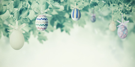 Easter eggs in green branches of tree, happy vintage holidays background