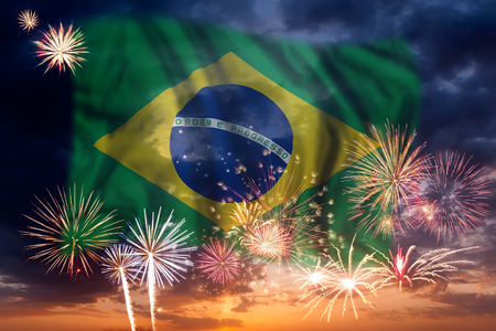 Holiday sky with fireworks and flag of Brazil, independence dayの写真素材