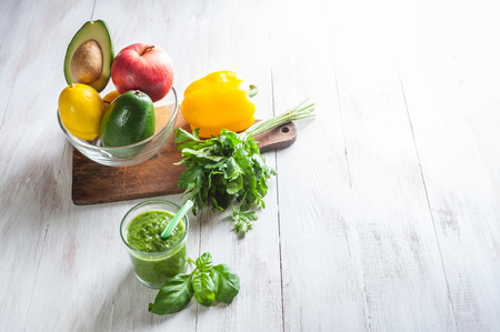 Green smoothie from fresh fruit and vegetables, healthy food background, selective focusの写真素材