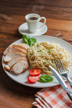 Italian spaghetti pasta with sauce and chicken, cheese parmesan and basil. Food backgroundの写真素材