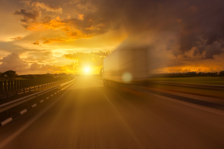 Track in motion blur on rvrning highway, fast delivery anywhere in the worldの写真素材