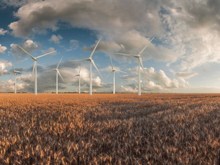 Industrial landscape with wind turbines in field, renewable eco energy, electric windmillsの写真素材