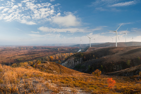 Industrial landscape with wind turbines on hills, renewable eco energy, electric windmillsの写真素材